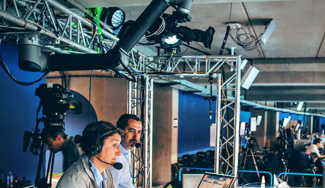 Image Featuring Usage Of Collaborative Robot In Television Industry - Professional Camera people With Headphones With HD Camcorder In Live Television.