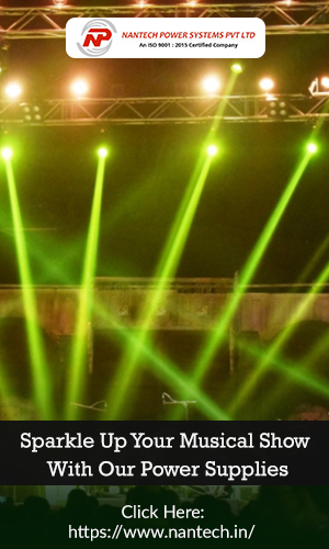 An empty stage of the musical concert, lit by spotlights with the much needed power backup supplies.